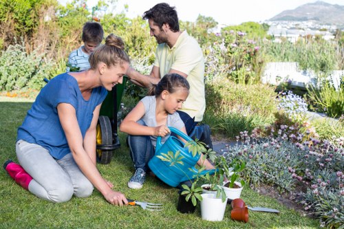 Community gardeners tending raised beds in a Hackney garden